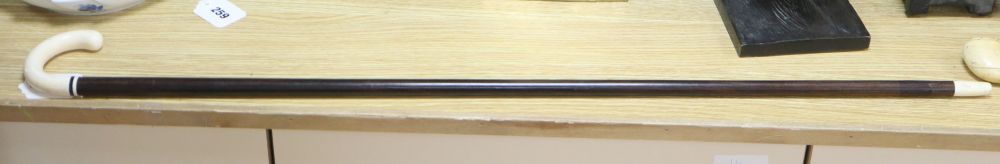 An ivory handled walking cane, c.1920, length 90cm